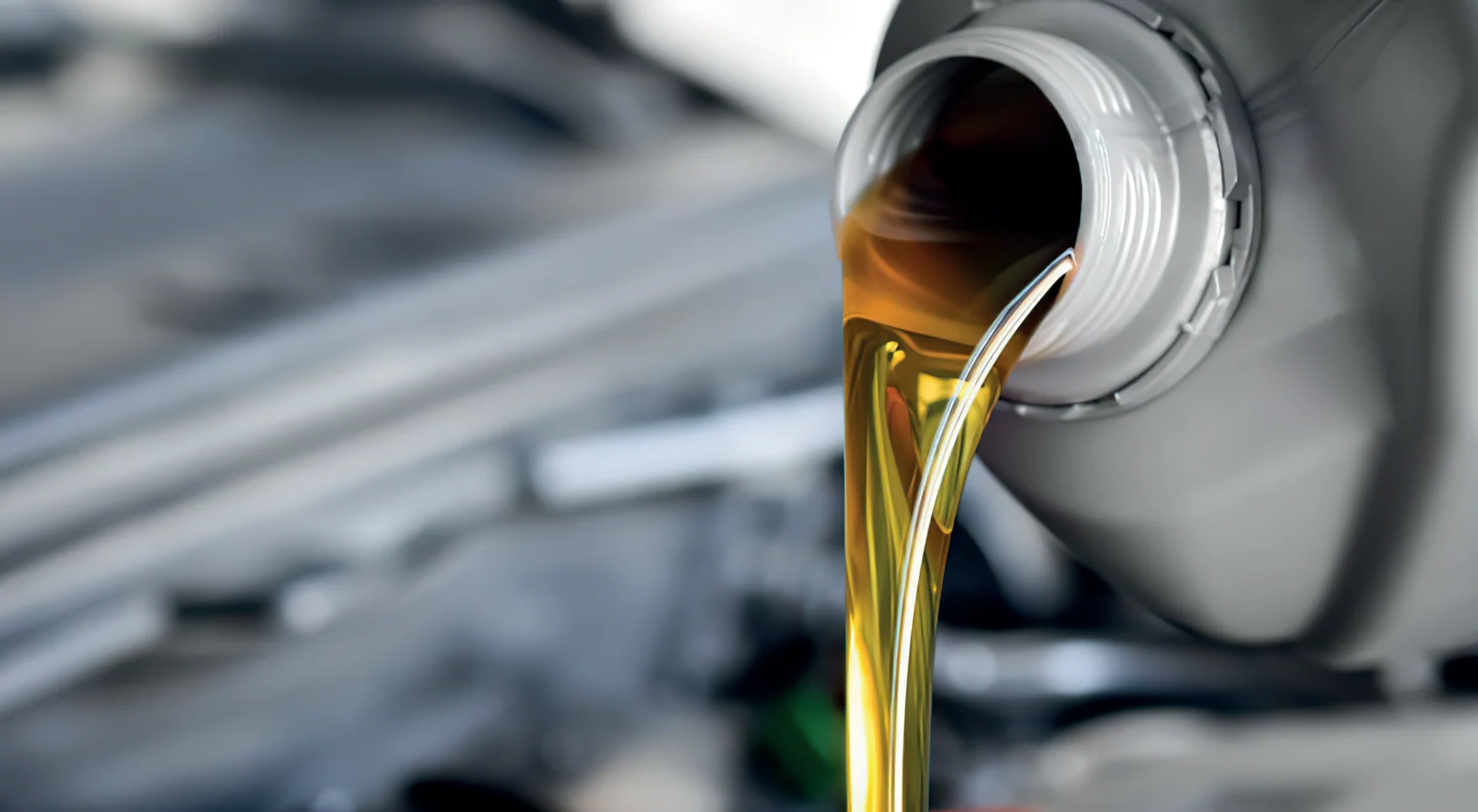 Golden motor oil being poured, from the supplied PowerPlus catalog